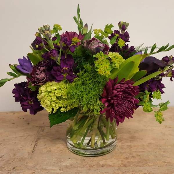 Arrangement of green and purple flowers
